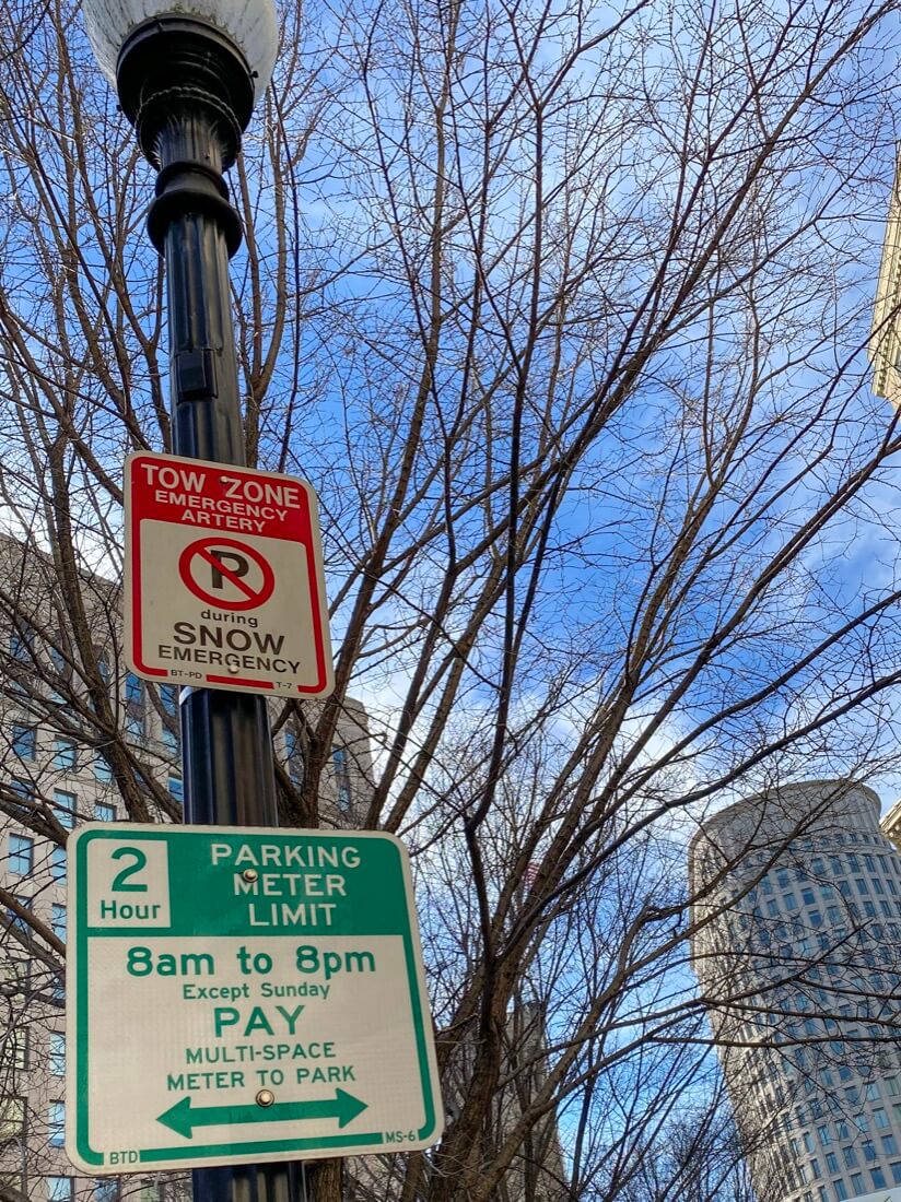 Boston Massachusetts tow zone and snow emergency and 2-hour limit parking signs