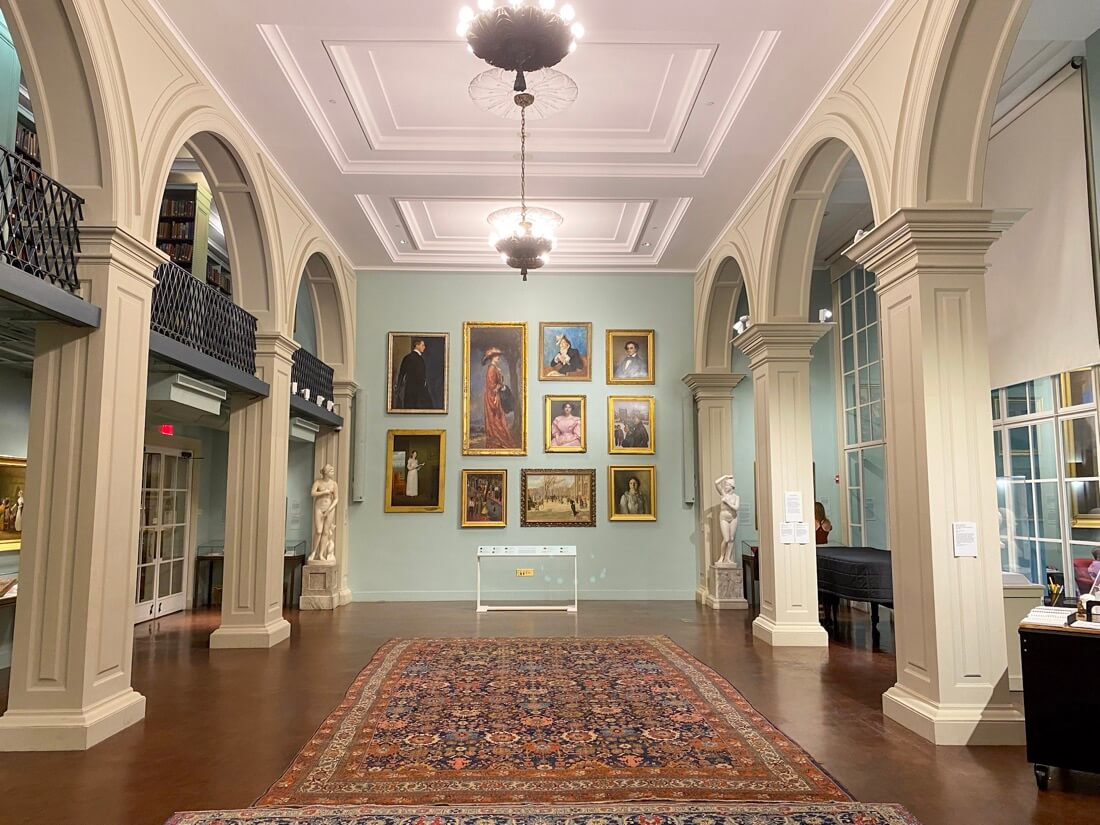 The Boston Athenaeum interior with art on walls in Boston Massachusetts