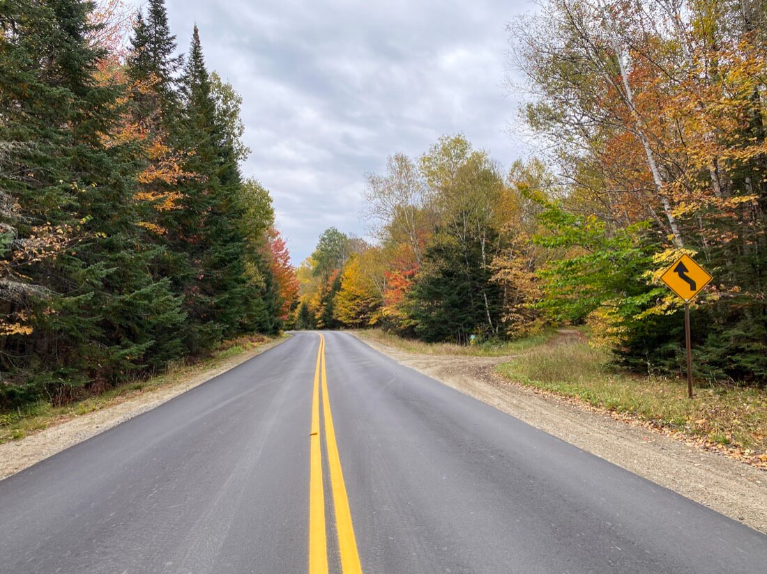 A fall foliage road trip view in Rangeley Maine