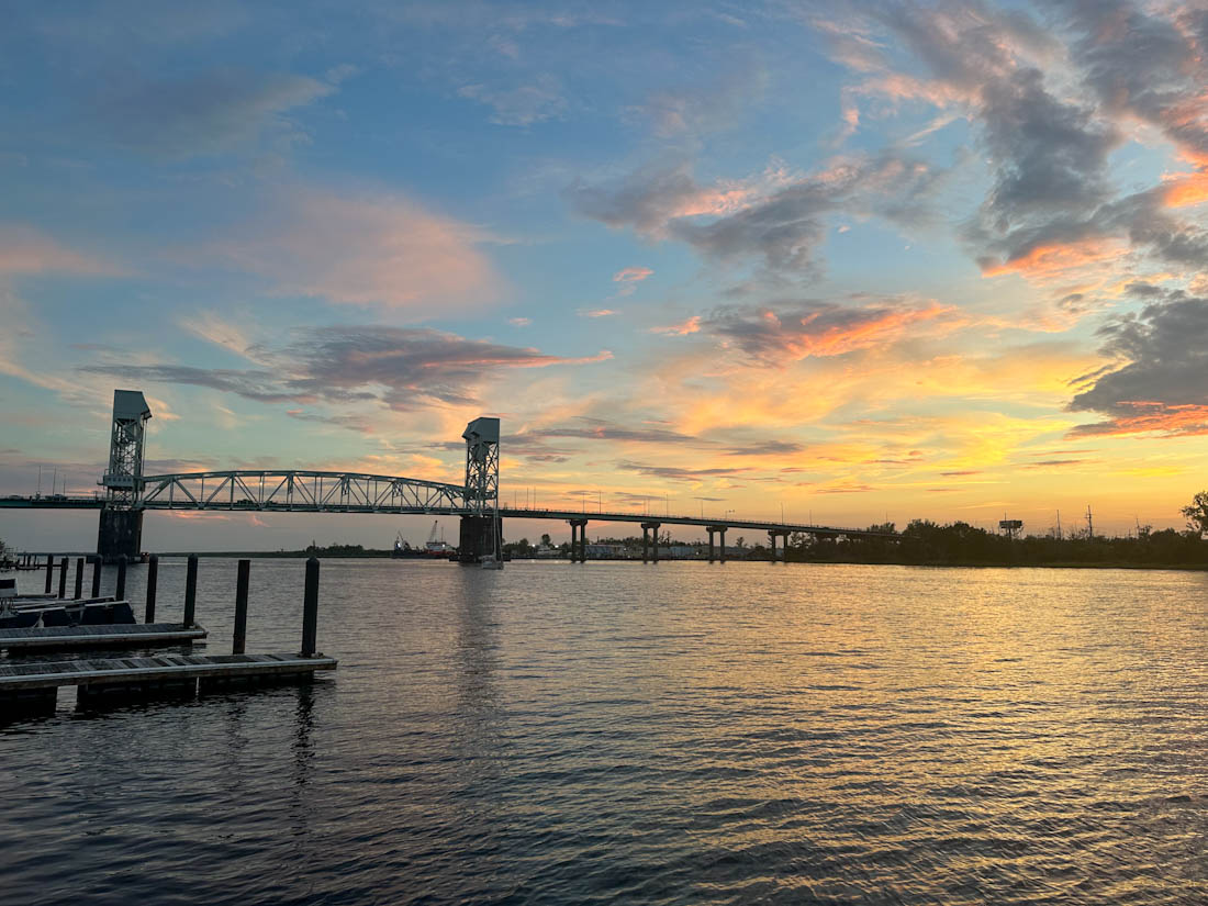 Cape Fear Memorial Bridge with sunset from Riverwalk Wilmington North Carolina