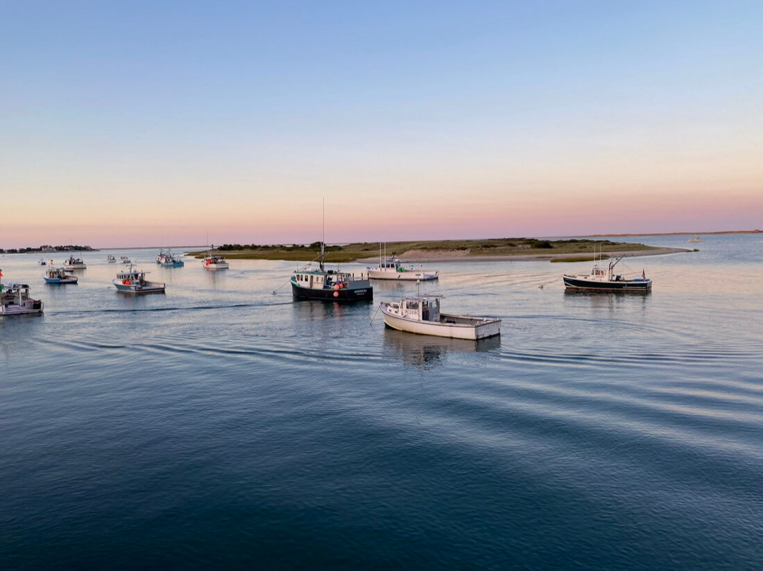 Sunset and boats at Chatham Fish Pier in Chatham Massachusetts