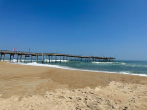 Blue waters and golden sand at Avon Beach Pier in the Outer Banks of North Carolina