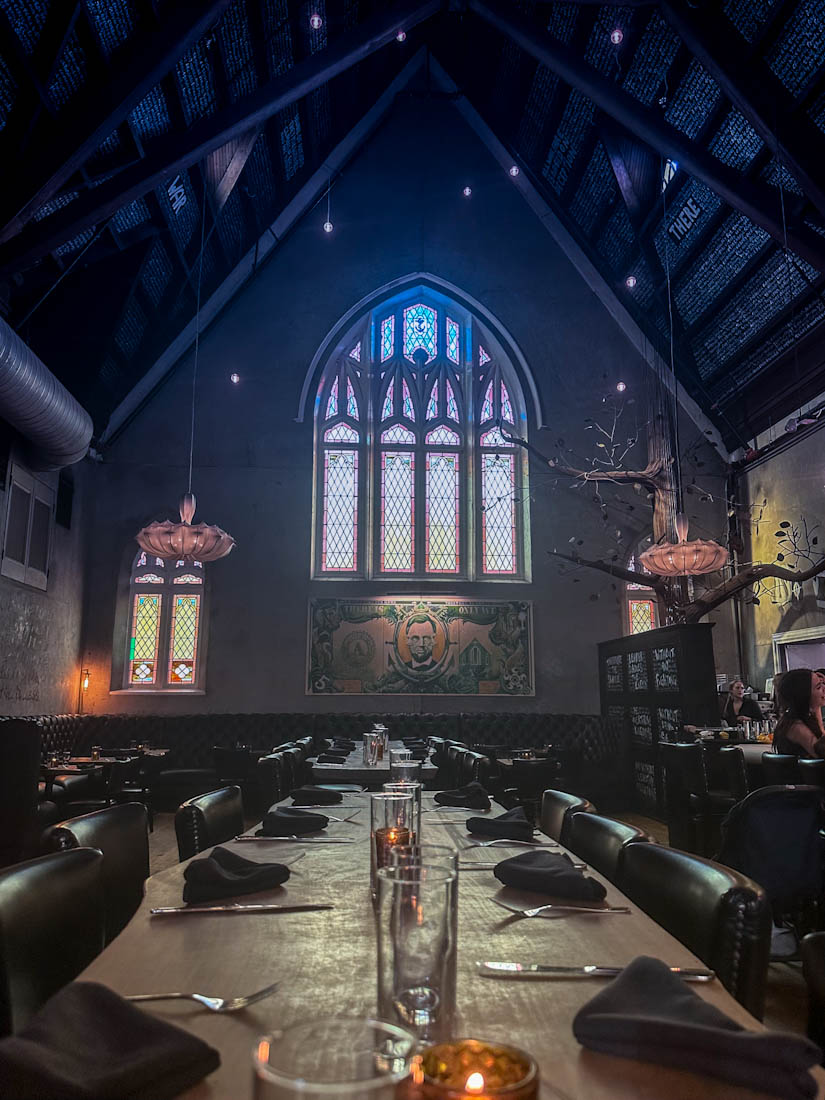 Inside Church and Union Bar with stain glass windows at City Market Charleston