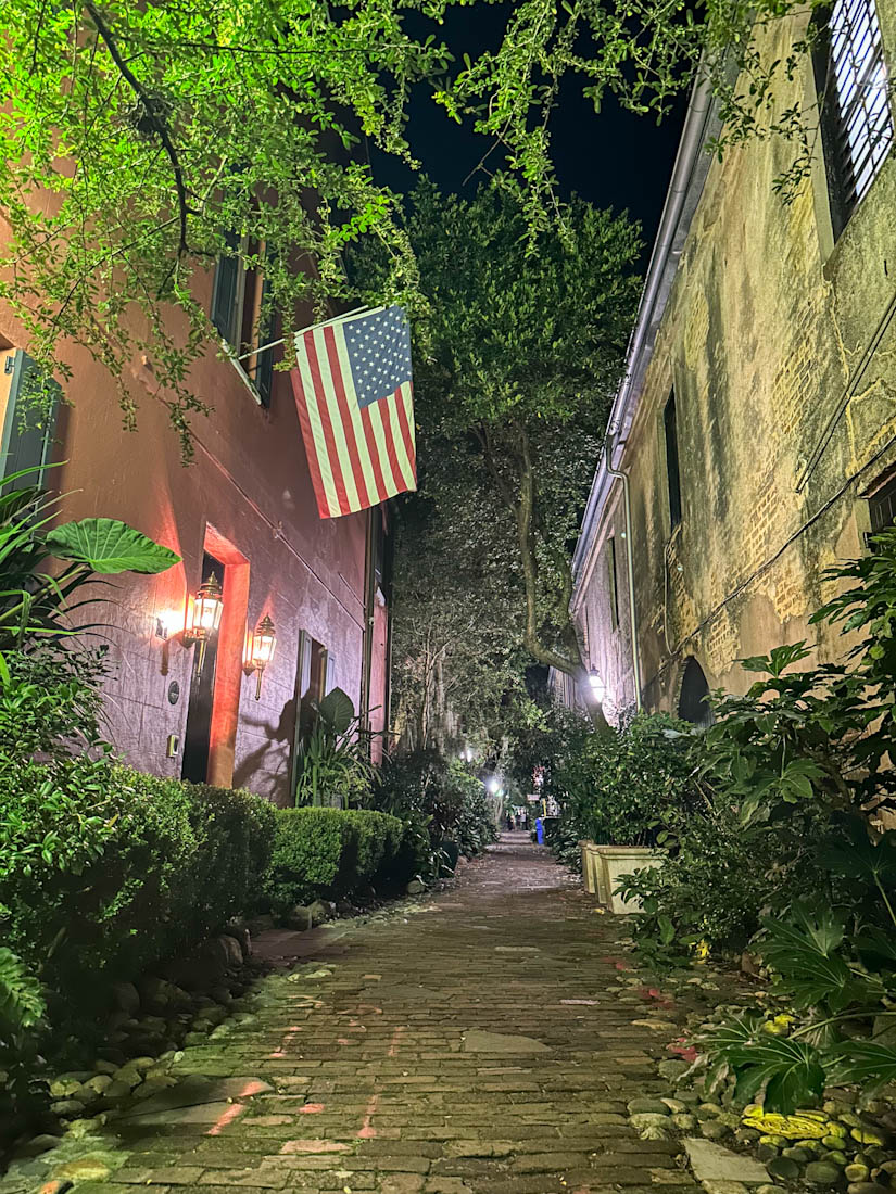 Philadelphia Alley lit up at night in Charleston, South Carolina