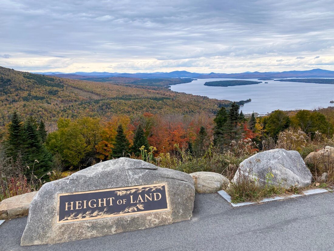 The marker and view at the Height of Land lookout in the Rangeley Lakes Region in Maine